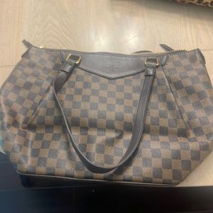 Dedigner looking brown bag u